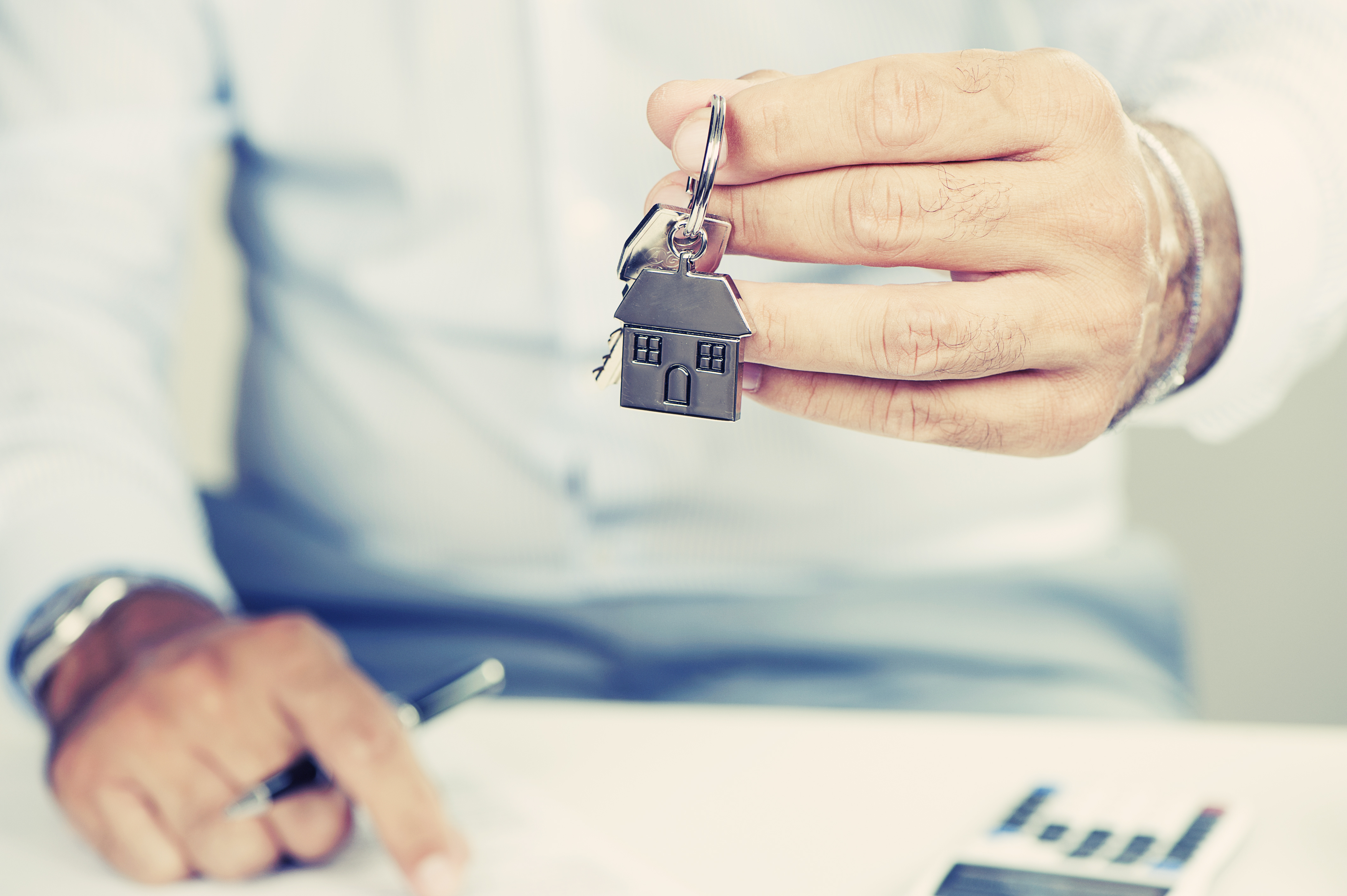 Hand with a house key